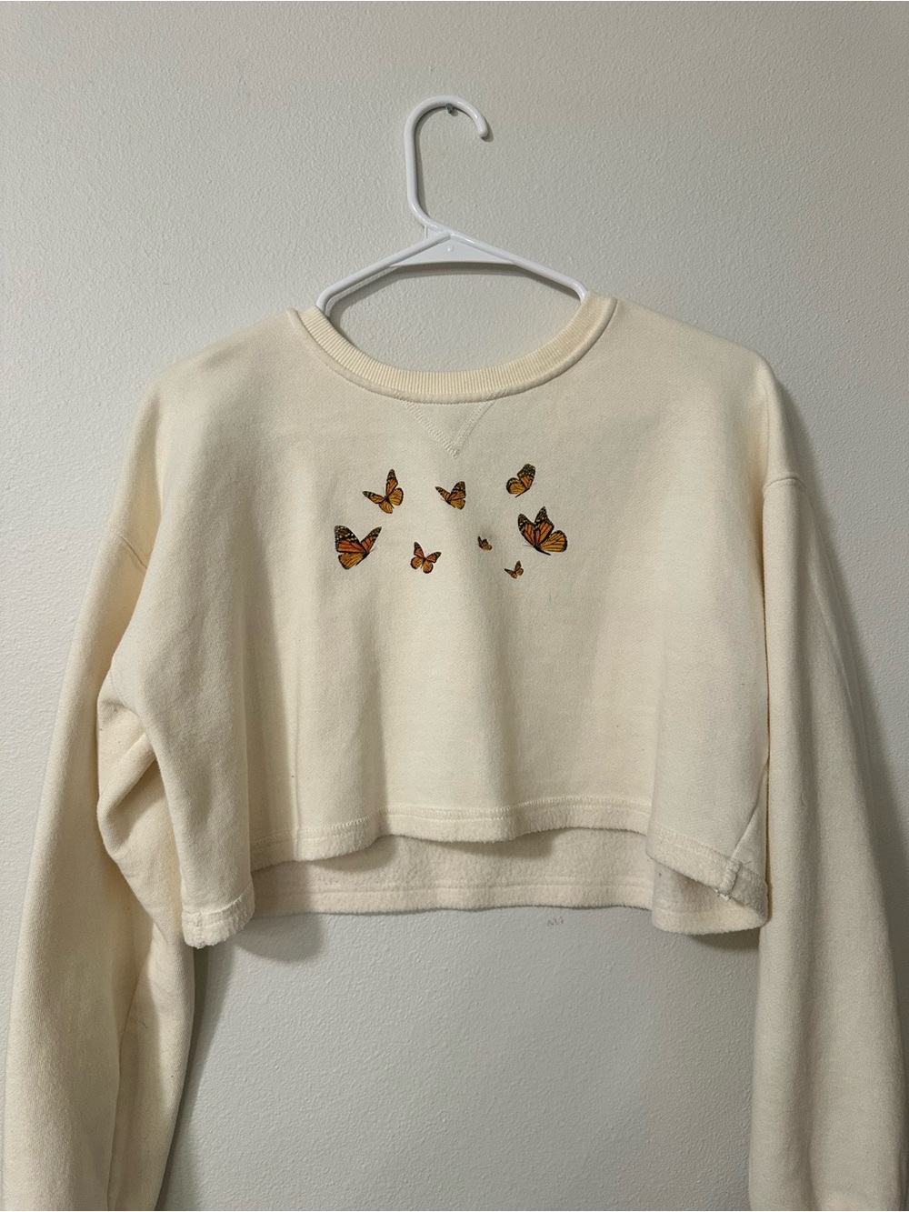 Cream Cropped Sweatshirt with Orange Butterfly Motif